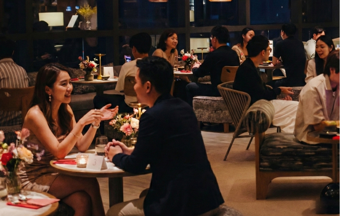 People chatting at an intentional speed dating event